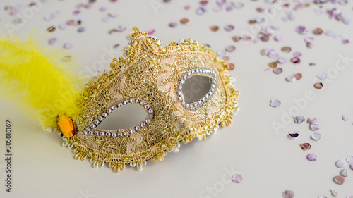 Golden carnival mask close-up on white background