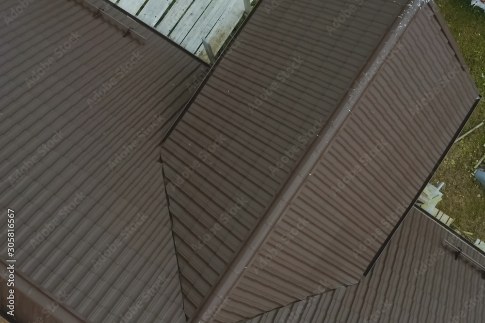 Obraz premium Corrugated metal roof and metal roofing. Modern roof made of met