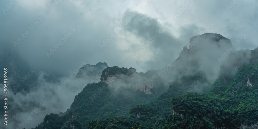 Tianmen mountains covered in early morning fog