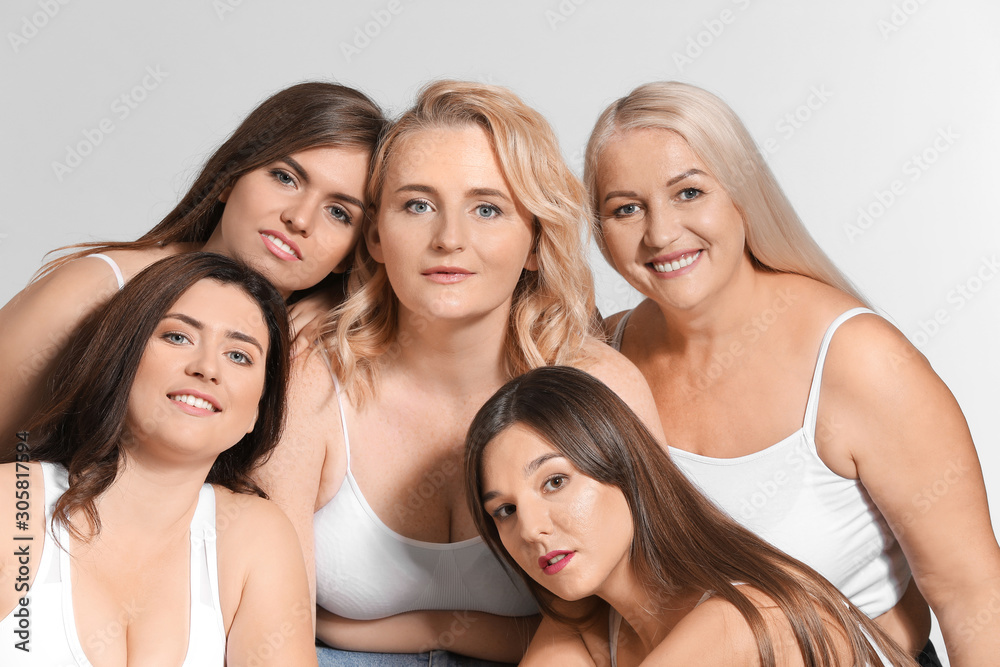 Group of body positive women on grey background Group of body positive women on grey background