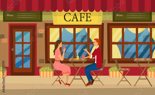 Loving couple is drinking coffee in a cafe. A man and a woman are sitting at the table in a cozy restaurant.