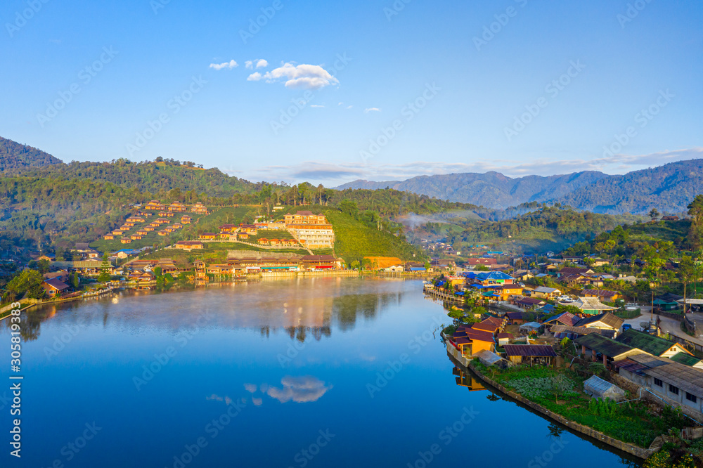Aerial landscape of Ban Rak Thai with sunrise in the morning located in Maehongsan province, Thailand. Aerial landscape of Ban Rak Thai with sunrise in the morning located in Maehongsan province, Thailand.