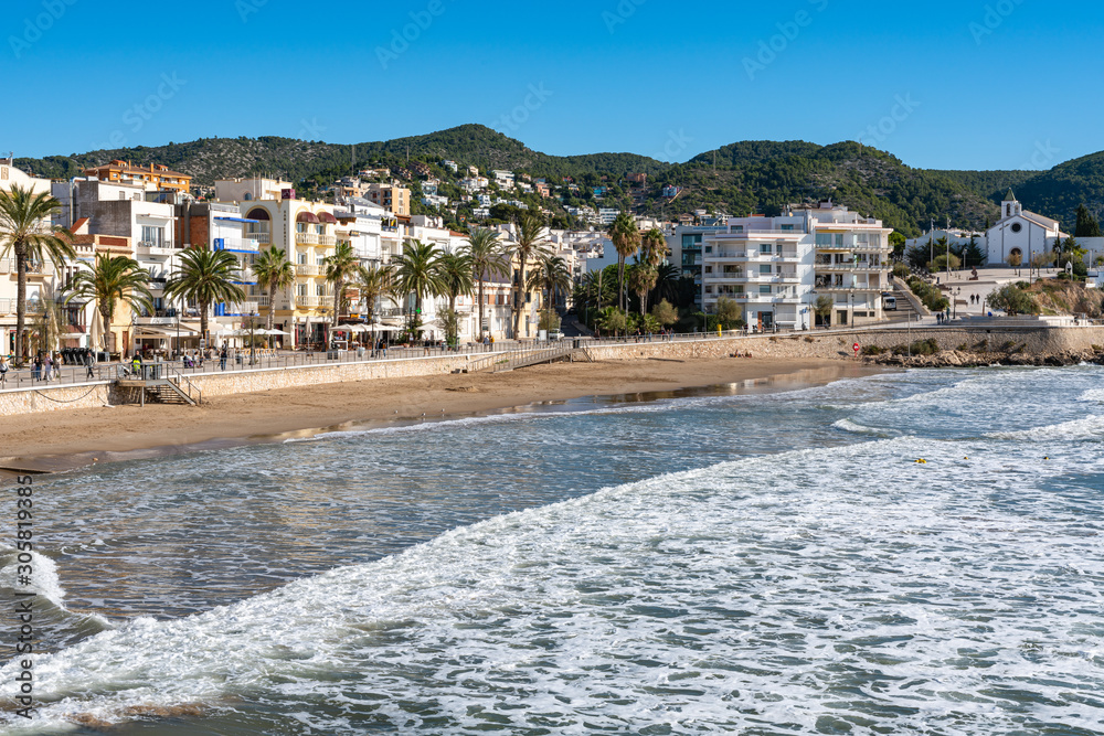 View of the sand beach and the city embankment. Sitges, Spain. 26 nov 2019