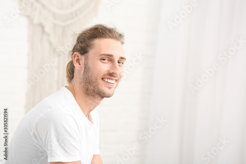 Young man with hearing aid ...
