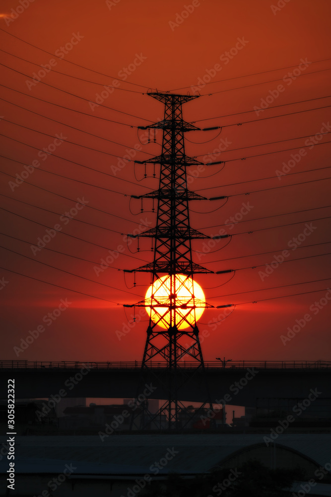 Naklejka premium China, city sundown and power lines. 