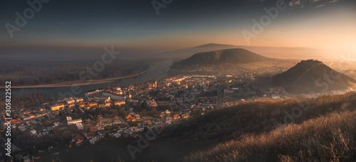 View of a Small City near Danube River at Sunrise. Hainburg an der Donau, Austria seen from Hundsheimer Hill. photo