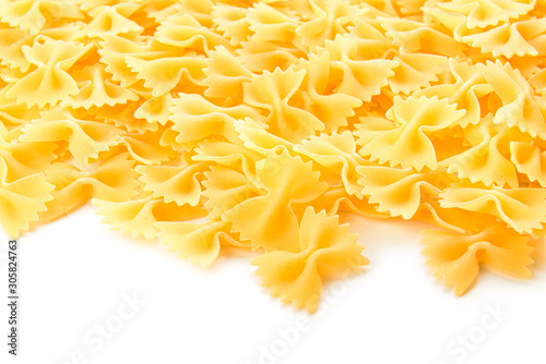 Tasty uncooked pasta on white background
