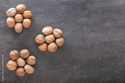 Tasty walnuts on dark background
