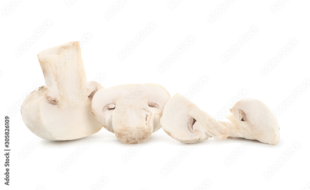 Fototapeta premium Fresh champignon mushrooms on white background