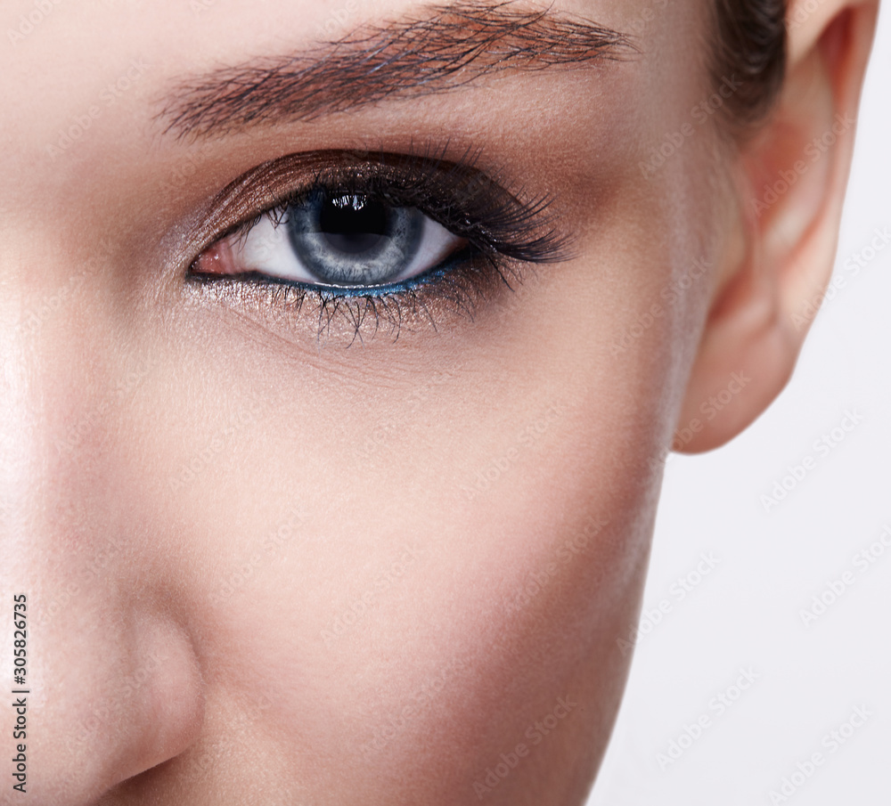 Fototapeta premium Closeup macro shot of blue human woman eye