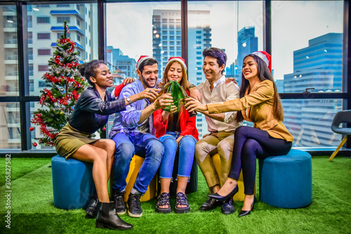 Friend group celebrate night party in office after work Merry Christmas Happy New Year concept ,Business team celebration night party