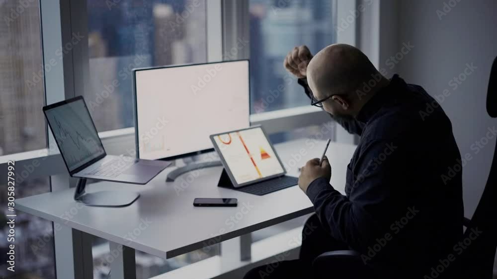 Overjoyed male executive manager with stylus pen excited with exchange statistics calling to financial director for sharing good news about capital investment, successful employee rejoicing with goal