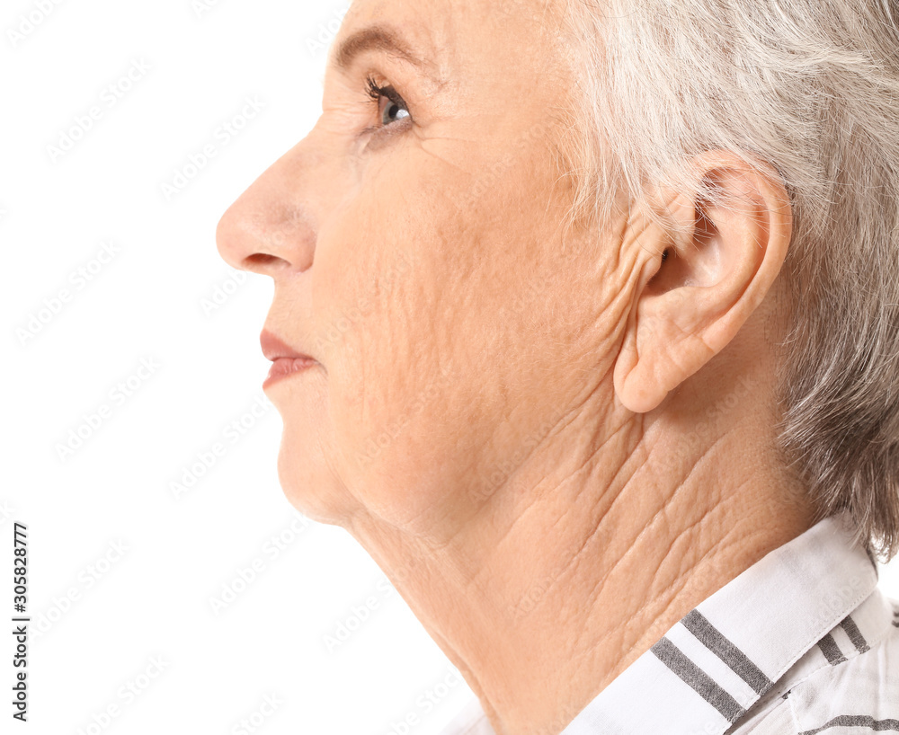 Fototapeta premium Senior woman with hearing problem on white background
