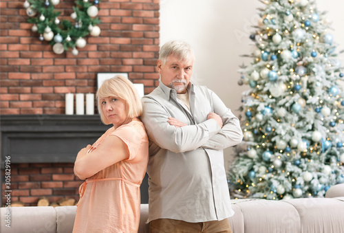 Angry mature couple at home