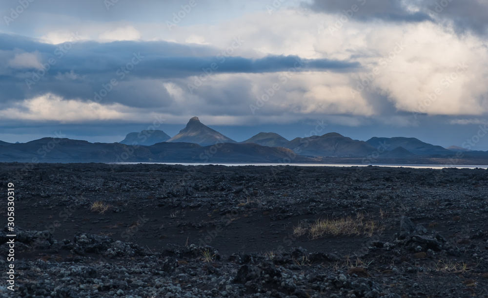 Iceland in september 2019. Great Valley Park Landmannalaugar, surrounded by mountains of rhyolite and unmelted snow. In the valley built large camp. Evening in september 2019