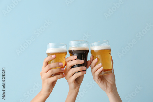 Hands with glasses of beer ...