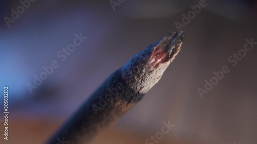 Stick of incense burning, close up macro