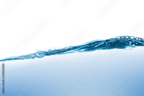 Water splash Aqua flowing in waves and creating bubbles Drops on the water surface feel fresh and clean isolated on white background