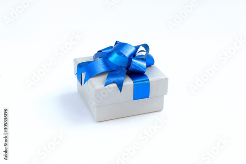 box with blue ribbon and bow isolated on white © sayayute