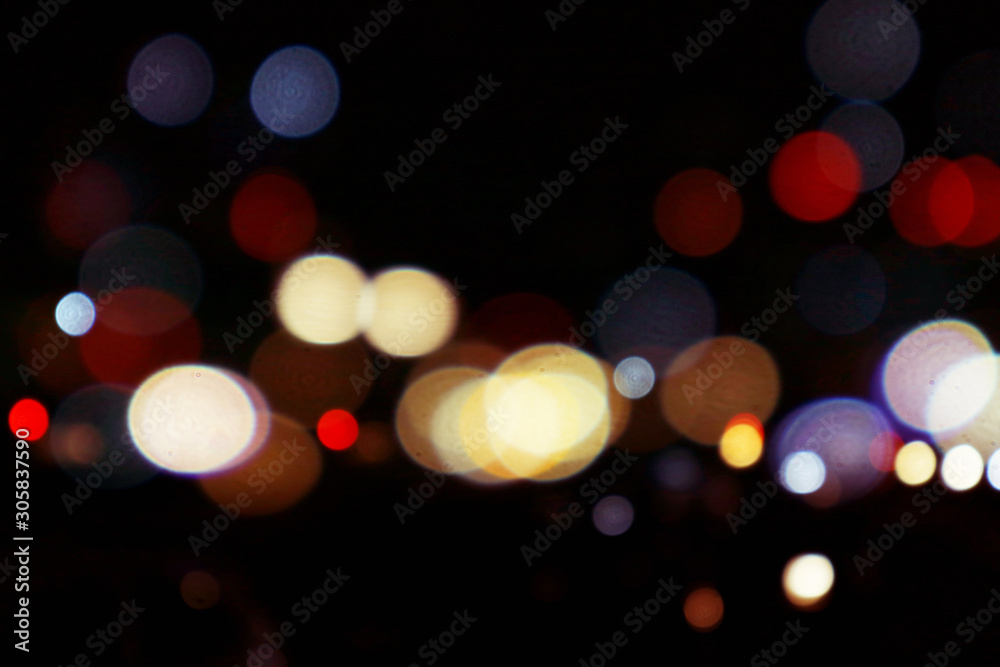 Bokeh night ligh Beautiful bokeh light on a black background with various colors, Blurred of car in city at night