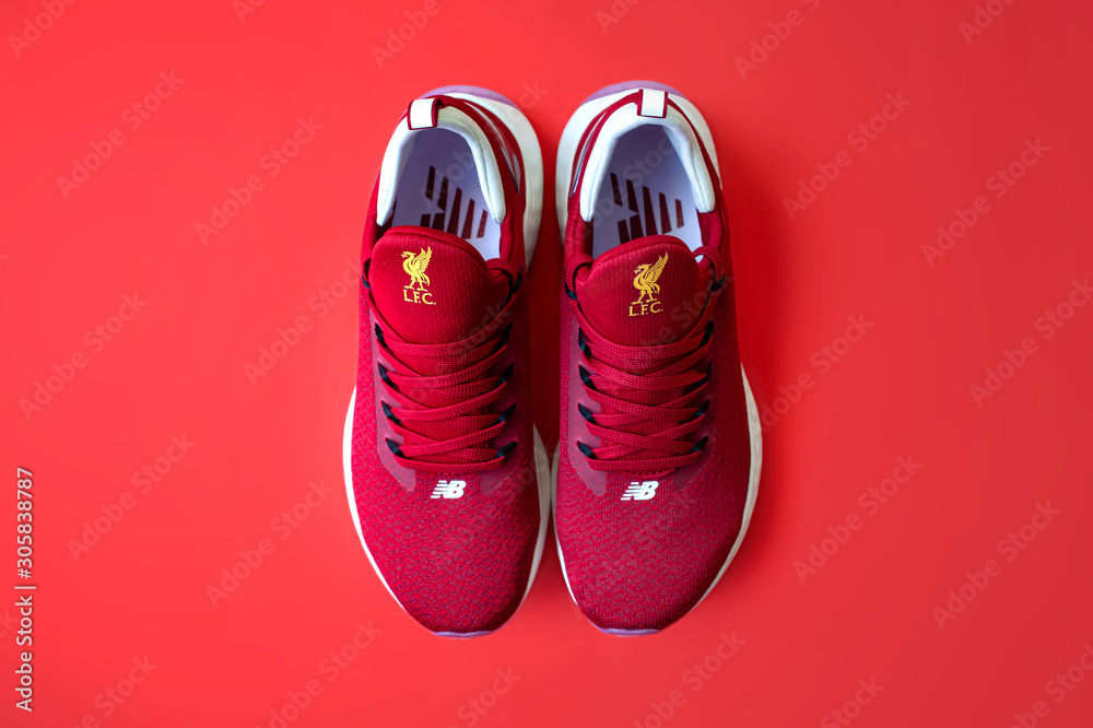 Thailand - September 13, 2019 : The lifestyle New Balance x Liverpool FC Fresh Foam Lazr v2 to celebrates most successful manager Bob version 2019/20 Home Kit Edition. Stock Photo | Adobe Stock
