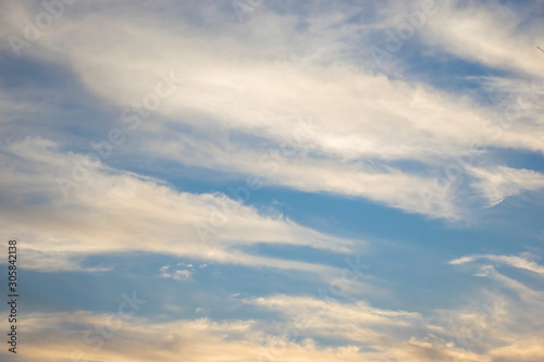 Blue and golden sky with many clouก background, twilight sky after sunset.