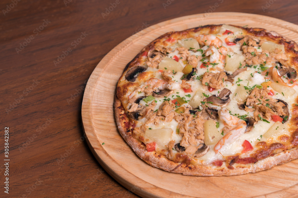Tuna pizza with shrimp and pineapple, isolated, top view. Tuna pizza with shrimp and pineapple, isolated, top view.