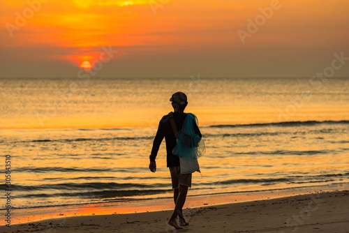 Prachuap Khiri Khan,Thailand - November, 17, 2019 : Unidentified name Native fishermen on the beach at Cha Am beach of Thailand in the morning sunsire time.