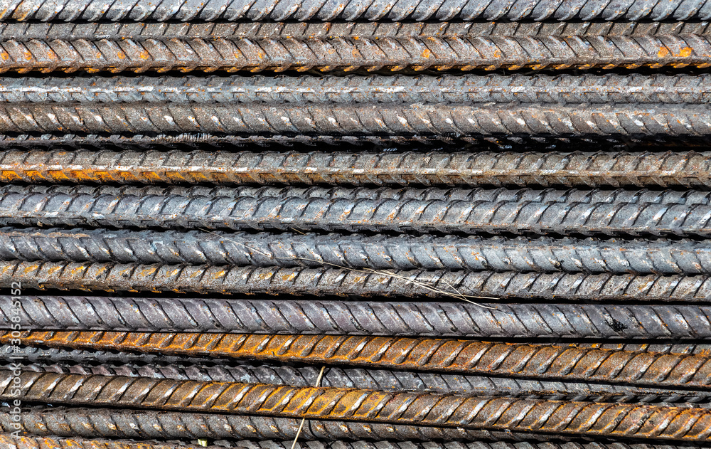 Pile of construction metal reinforcement at a construction site close-up.