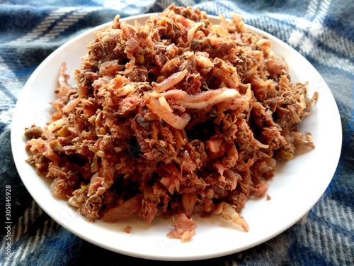 Traditional indonesian culinary food. The food name is Lawar Barak. Lawar Bali Indonesian Food that is simple and delicious. Indonesian Street Food.