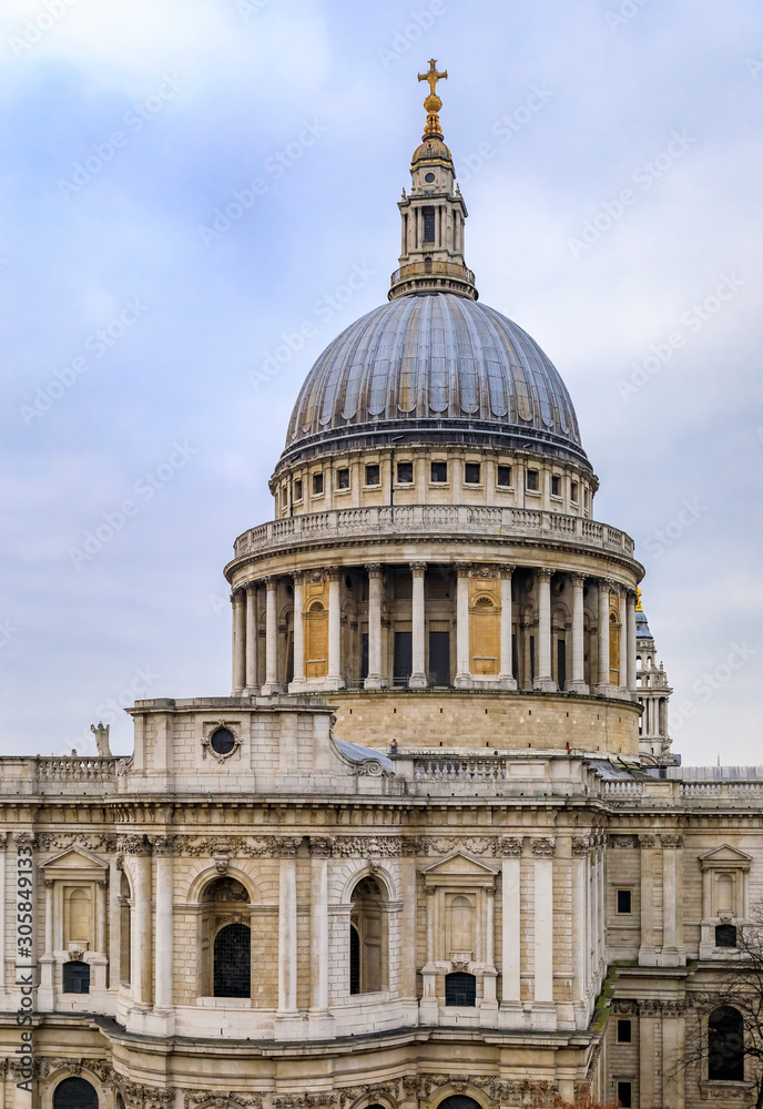 View of the dome of the famous St. Paul's Cathedral in city center on a cloudy day in London, England View of the dome of the famous St. Paul's Cathedral in city center on a cloudy day in London, England