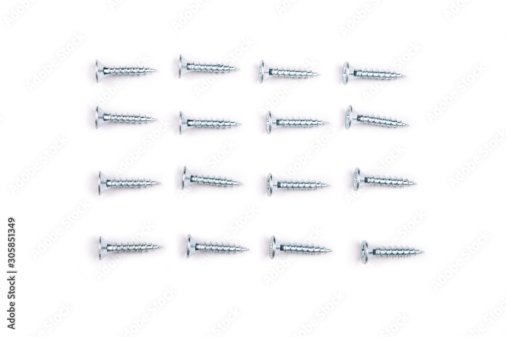 Fototapeta premium Metal screws for wood on white background. Isolate