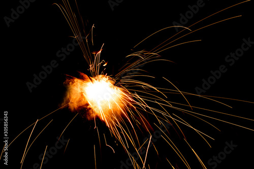 long exposure fire sparks on black background