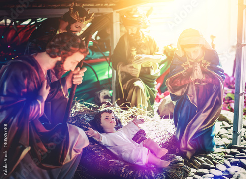 The traditional Christmas scene and the sacred light shining down for use in illustrations of the baby nativity scene, including Jesus, Mary and Joseph.