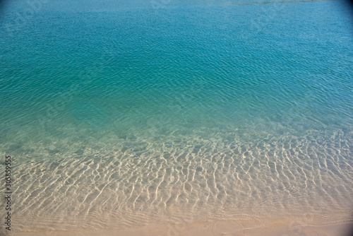 clean blue water from shallow to deep