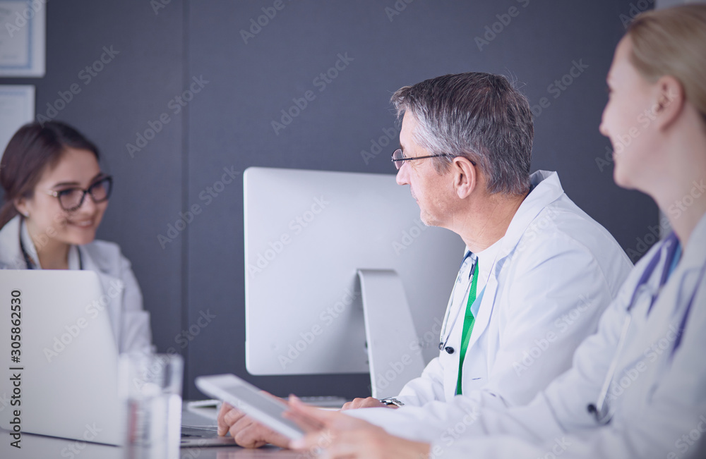 Doctors having a medical discussion in a meeting room Doctors having a medical discussion in a meeting room