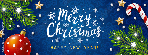 Horizontal panoramic banner with Christmas tree branches on blue background for holiday design