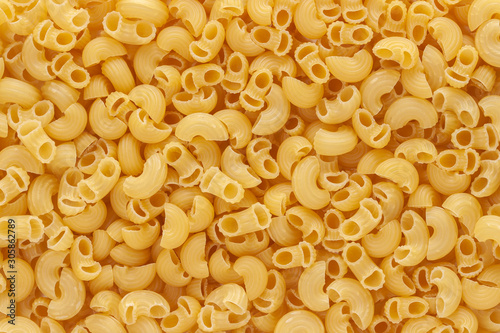Dried uncooked macaroni little noodle above view macro