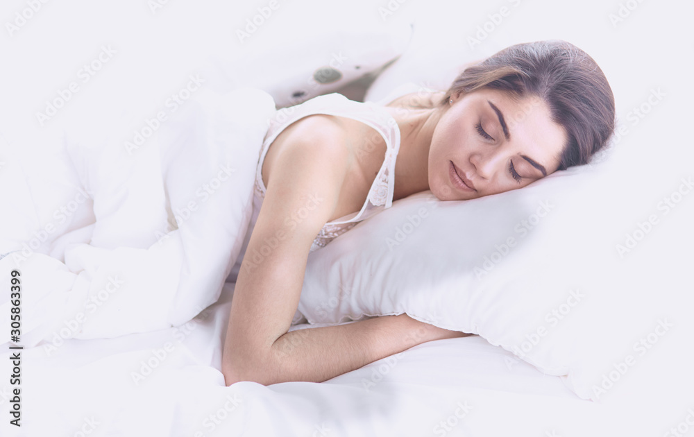 beautiful young woman basking in bed in the morning. Beautiful beautiful young woman basking in bed in the morning. Beautiful