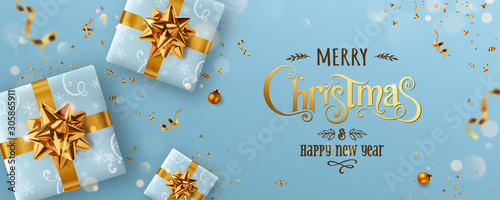 Gold Christmas and New Year Text on blue Xmas background with gift boxes, fir branches, gold ribbon, decoration, sparkles, confetti, bokeh. Merry Christmas card. Vector Illustration, realistic vector