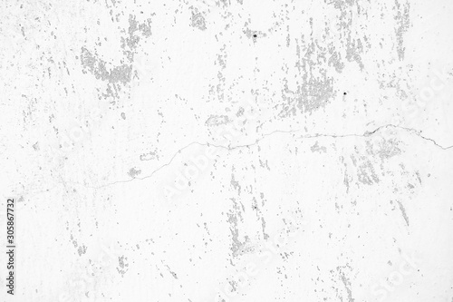 Close-up of White cement wall peeled paint caused by water and sunlight. Peel wall of White house paint with black stain. Black and White of Texture background.