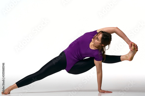 Portrait of young attractive woman doing exercises on yoga mat. Healthy lifestyle and sports concept. Series of exercise poses. Isolated on white