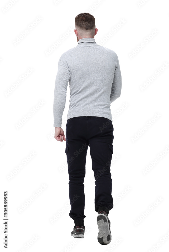 rear view. a young man in a white pullover walks forward rear view. a young man in a white pullover walks forward