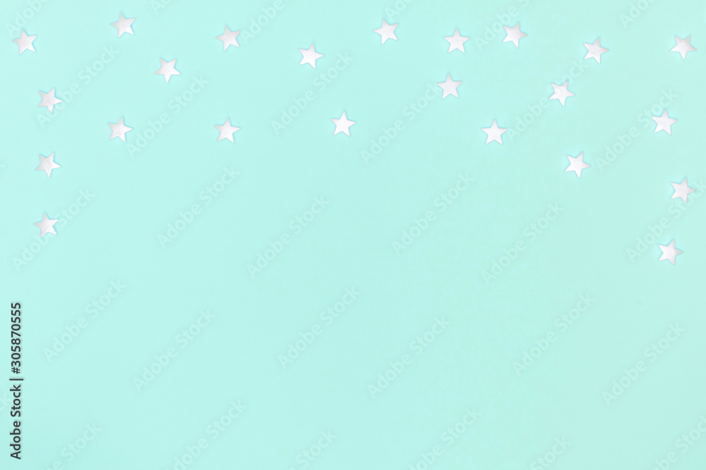 New year, Christmas frame, greeting card. White stars on pastel blue background. Top view, flat lay, copy space New year, Christmas frame, greeting card. White stars on pastel blue background. Top view, flat lay, copy space