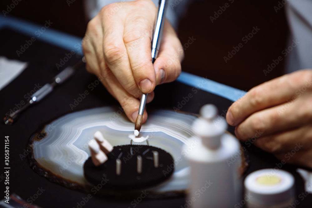 Dental technician makes dentures. Dental technician makes dentures.