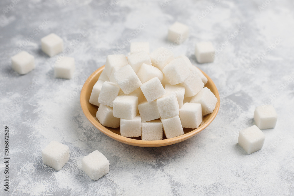 White sugar cubes on concrete background,top view White sugar cubes on concrete background,top view