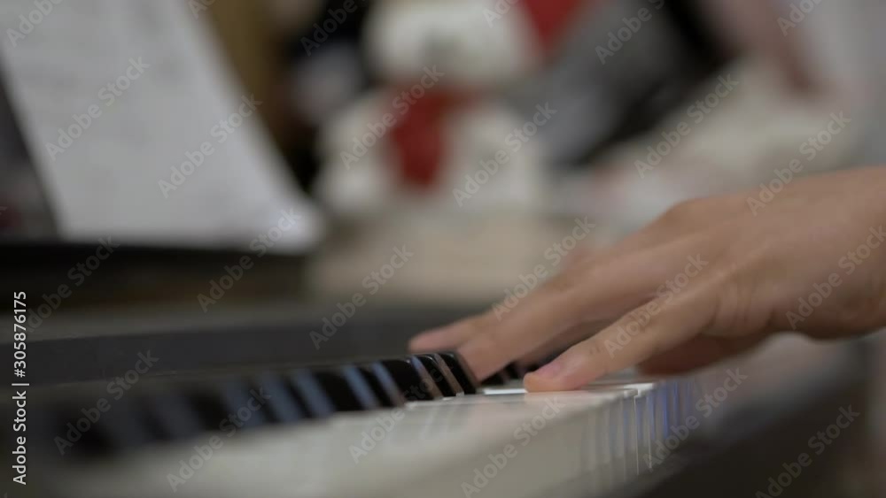 Close up shot of a pianist playing the piano with a very shallow depth of field Close up shot of a pianist playing the piano with a very shallow depth of field