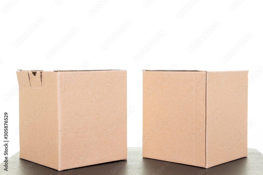 Two brown cardboard carton parcels corrugated Two brown cardboard carton parcels corrugated