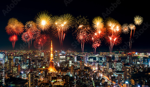 Fireworks over Tokyo cityscape at night, Japan