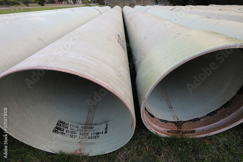 Kleinbrak, South Africa, November 15, 2019 - Massive unused underground water pipes on a plain outside Kleinbrak. The are massive and long with a huge capacity photo